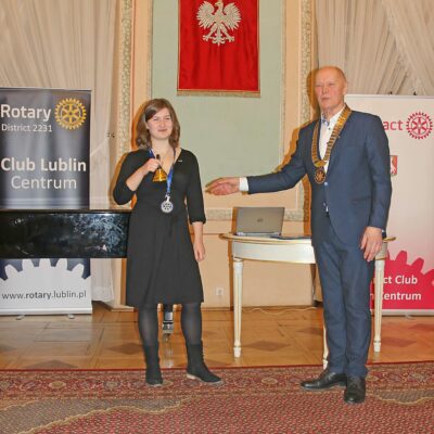 President of Rotaract Club Hania Wieczorek with received bell and neck chain